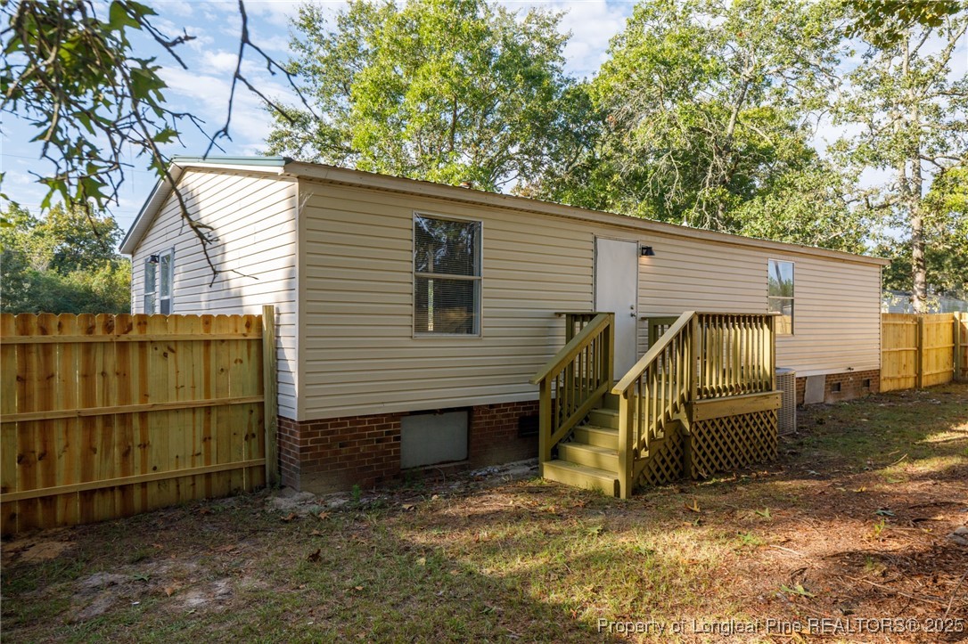 212 Heflin Road Aberdeen, NC 28315 - Photo 23 of 23 a view of a house with a patio
