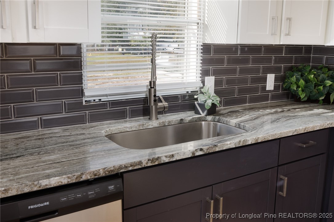 212 Heflin Road Aberdeen, NC 28315 - Photo 7 of 23 a close view of sink and mirror