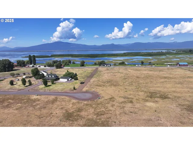 a view of a room with a kitchen