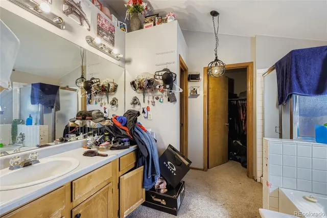 a bedroom with a bed a window and flowerpot
