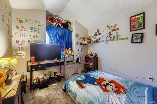 a bathroom with a sink mirror and shower