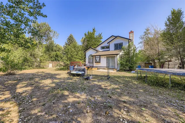 a house view with a backyard space