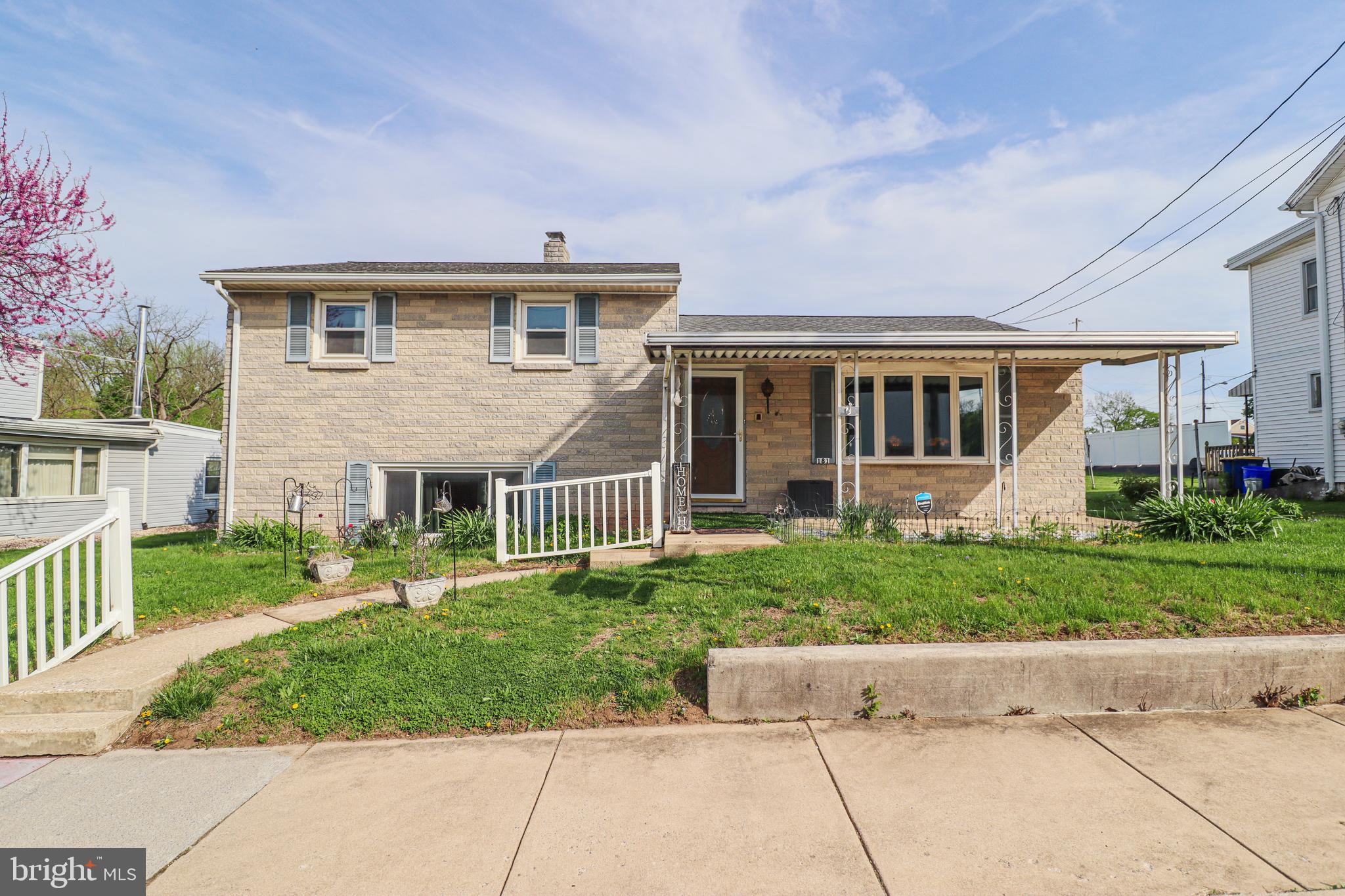 front view of a house with a yard