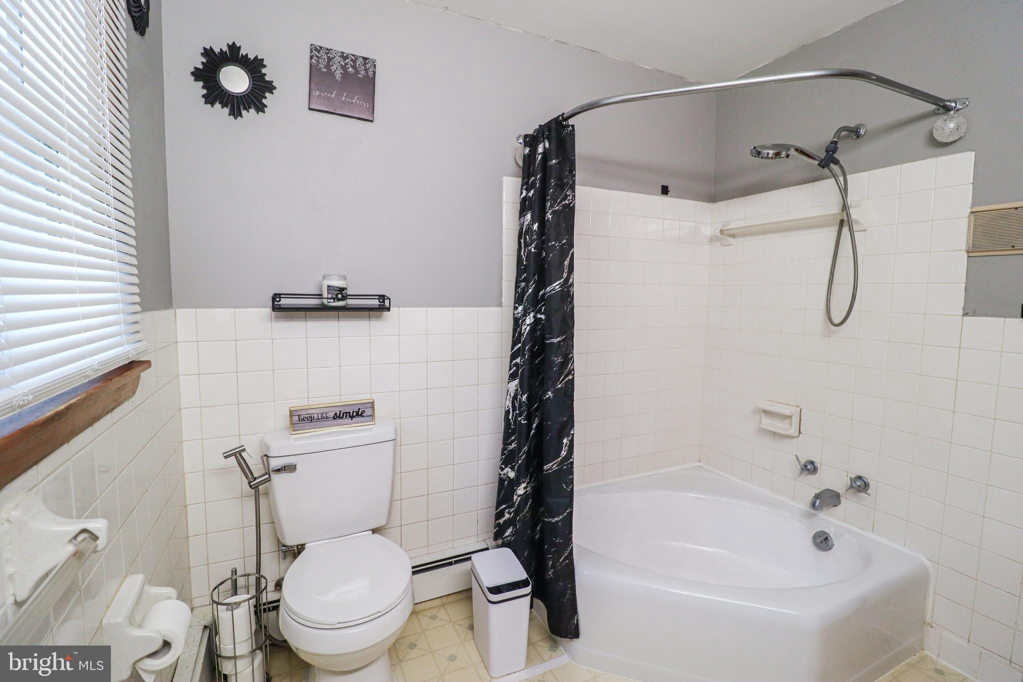 181 South Main Street Mount Wolf, PA 17347 - Photo 12 of 33 a white toilet sitting next to a bath tub and shower