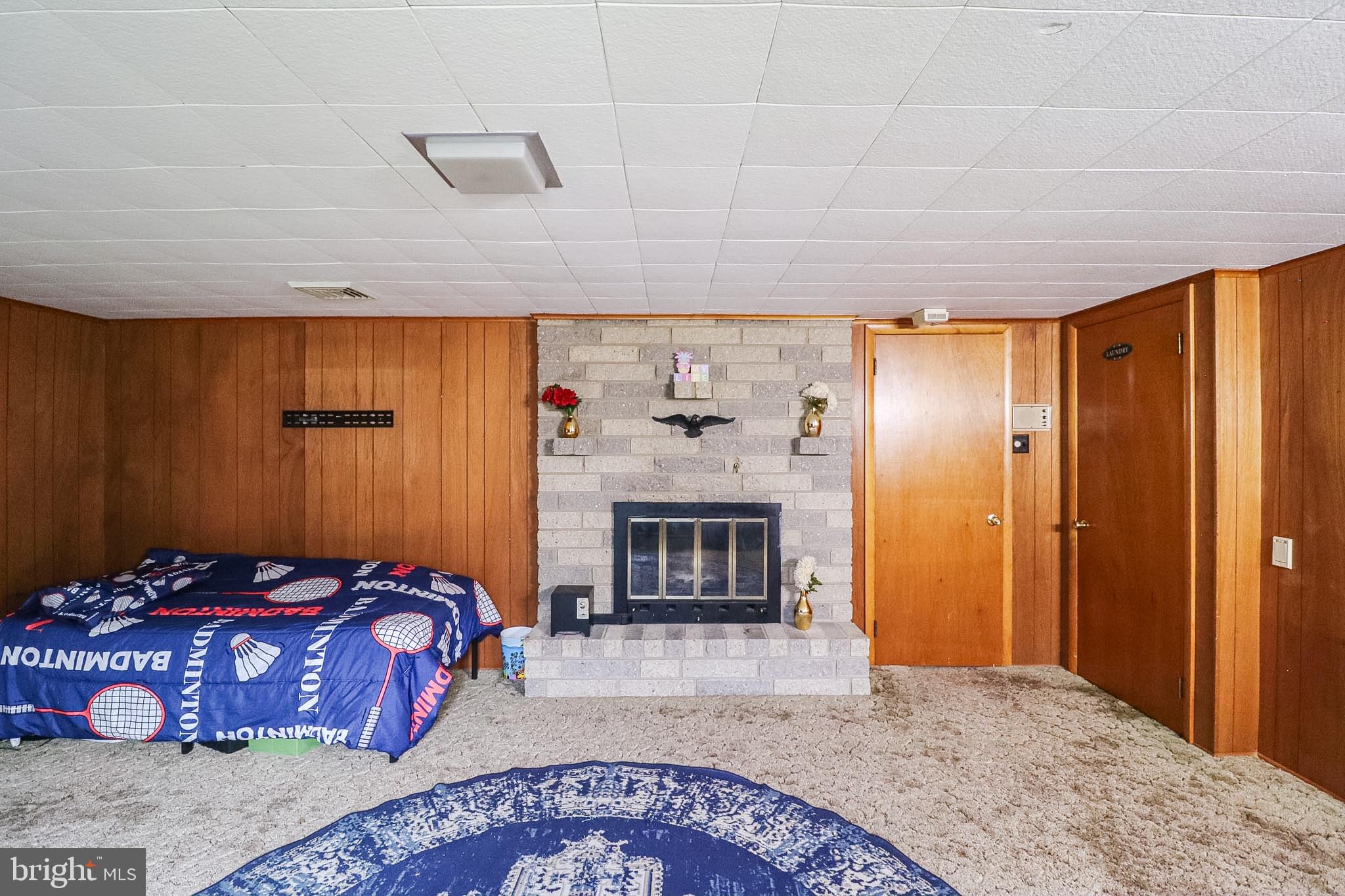 181 South Main Street Mount Wolf, PA 17347 - Photo 15 of 33 a bedroom with a bed and a fireplace