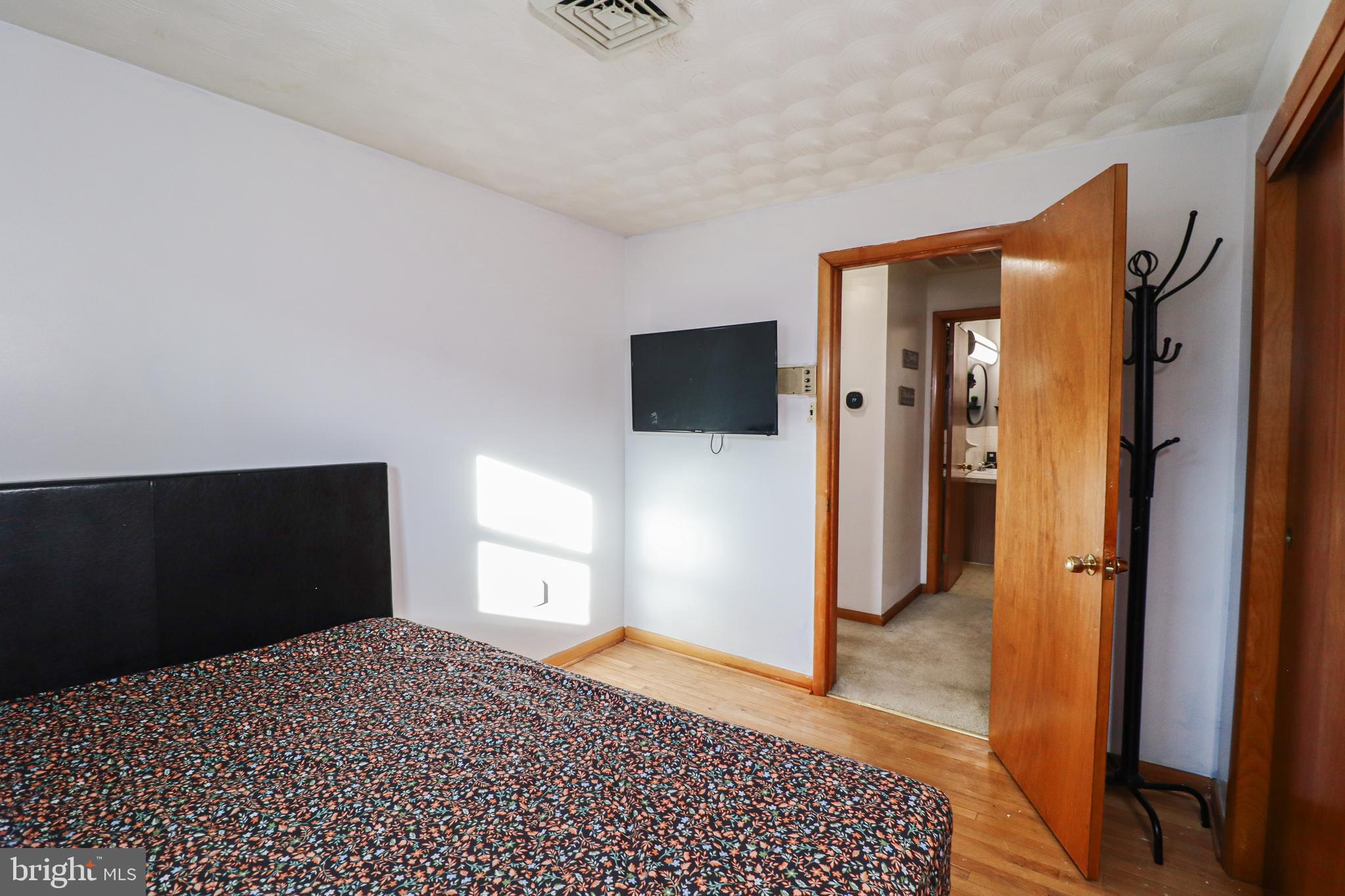 181 South Main Street Mount Wolf, PA 17347 - Photo 16 of 33 a bedroom with a bed and a television