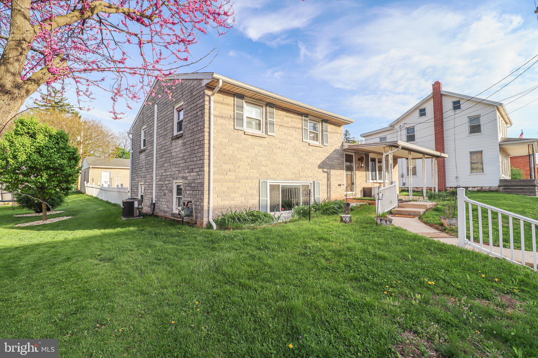 181 South Main Street Mount Wolf, PA 17347 - Photo 2 of 33 a front view of a house with garden