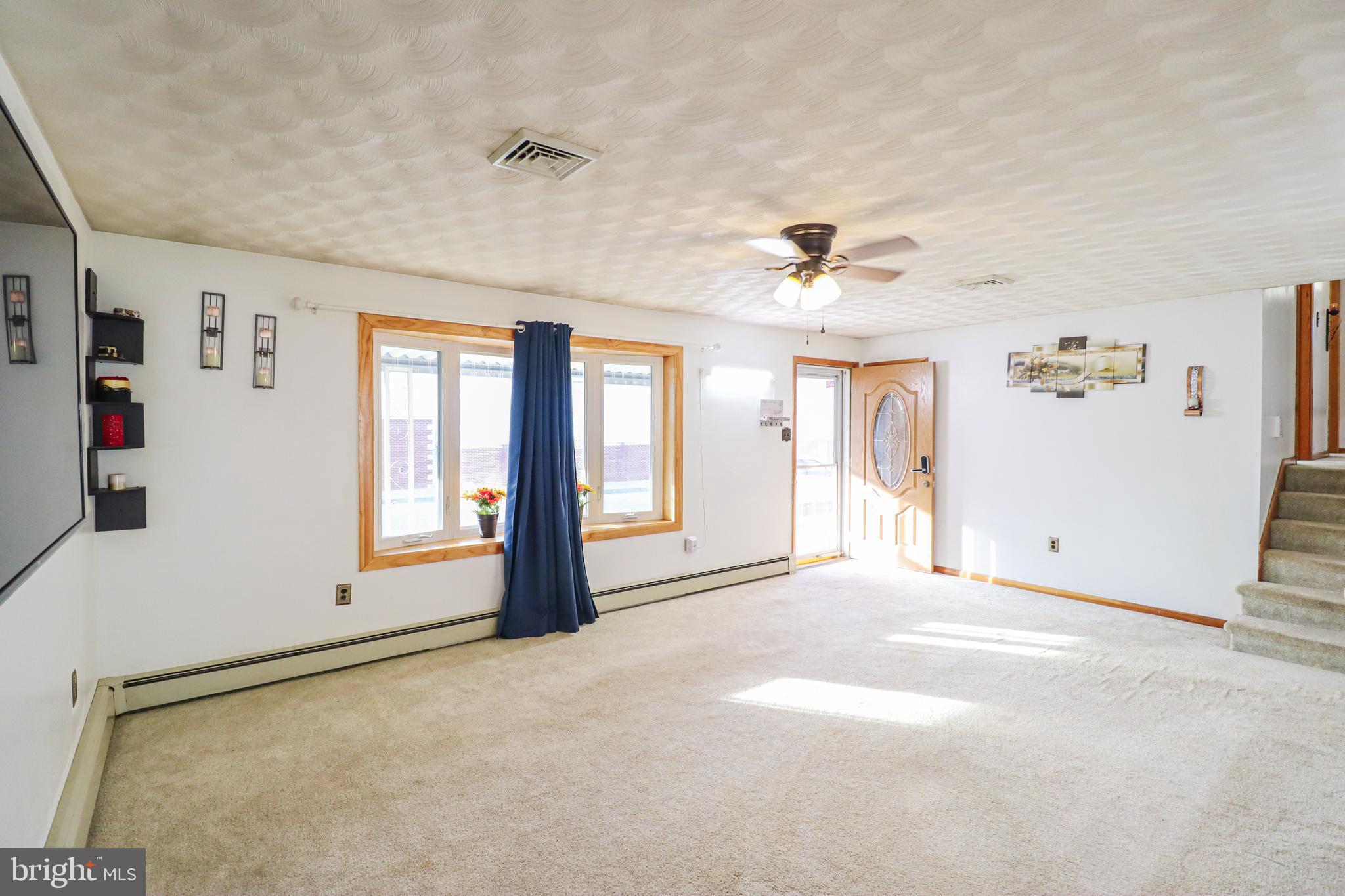 181 South Main Street Mount Wolf, PA 17347 - Photo 4 of 33 a view of an empty room with a window