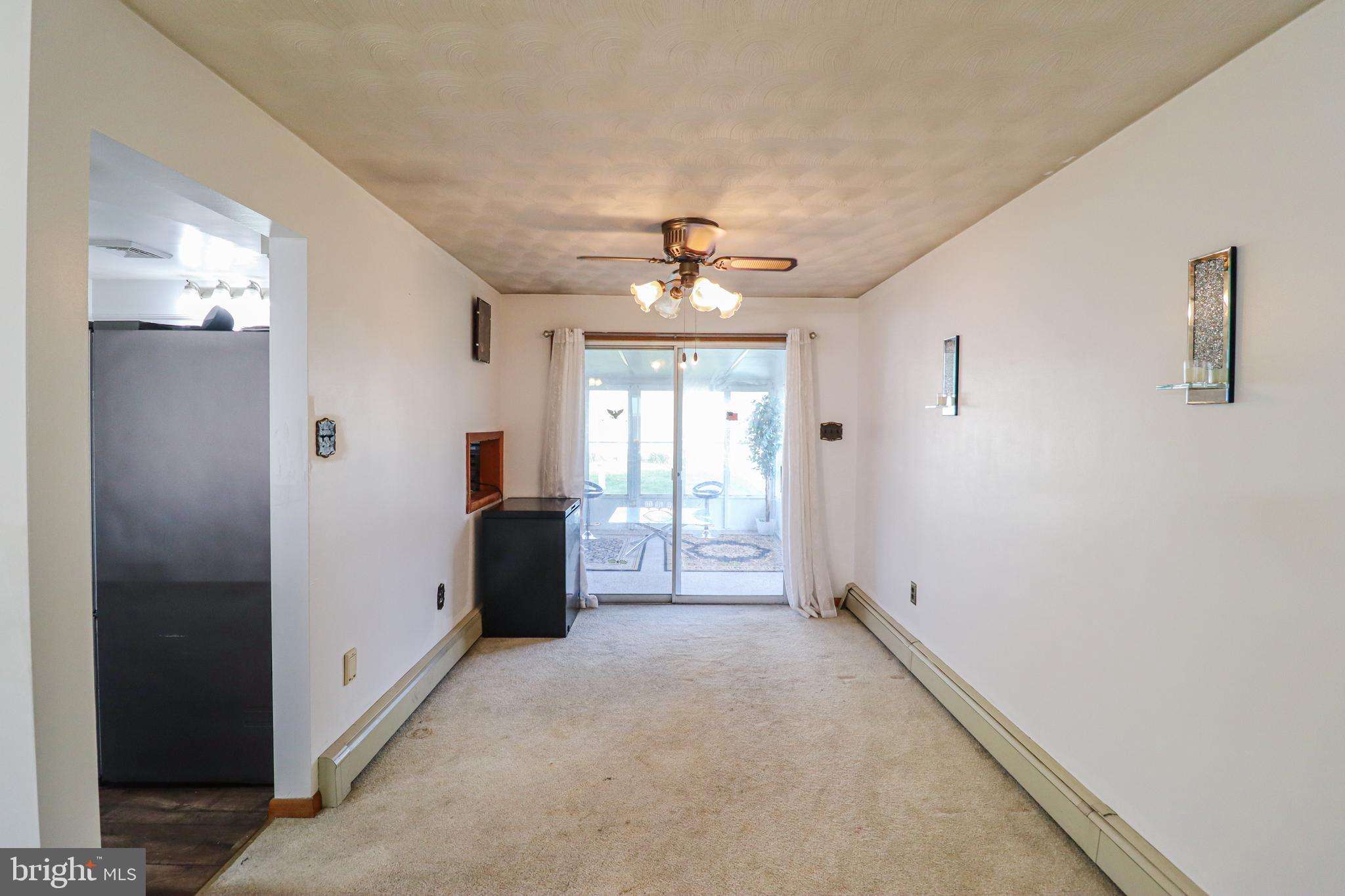 181 South Main Street Mount Wolf, PA 17347 - Photo 7 of 33 a view of a hallway with windows and chandelier fan