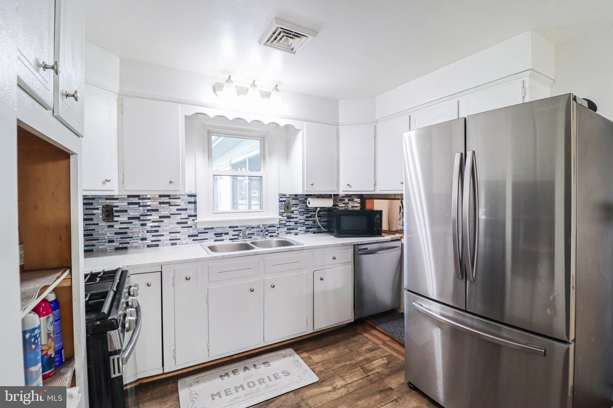 181 South Main Street Mount Wolf, PA 17347 - Photo 9 of 33 a kitchen with stainless steel appliances granite countertop a refrigerator and a sink