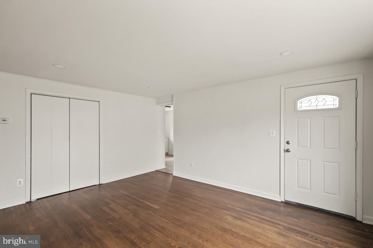 10725 Maple Street Fairfax, VA 22030 - Photo 13 of 42 a view of an empty room with wooden floor