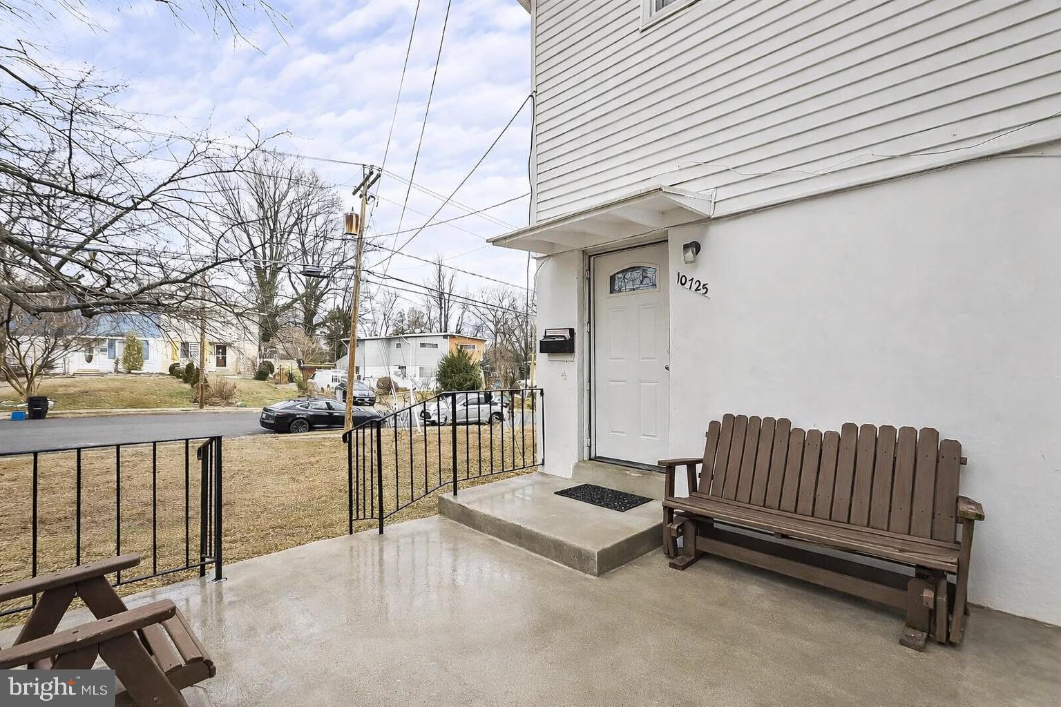 10725 Maple Street Fairfax, VA 22030 - Photo 8 of 42 a view of a porch with furniture and a yard