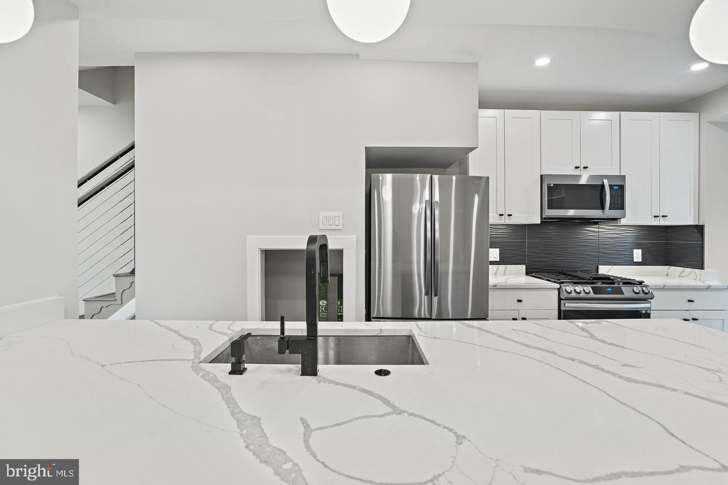 719 Quebec Place Northwest Washington, DC 20010 - Photo 13 of 32 Sleek kitchen with modern finishes.