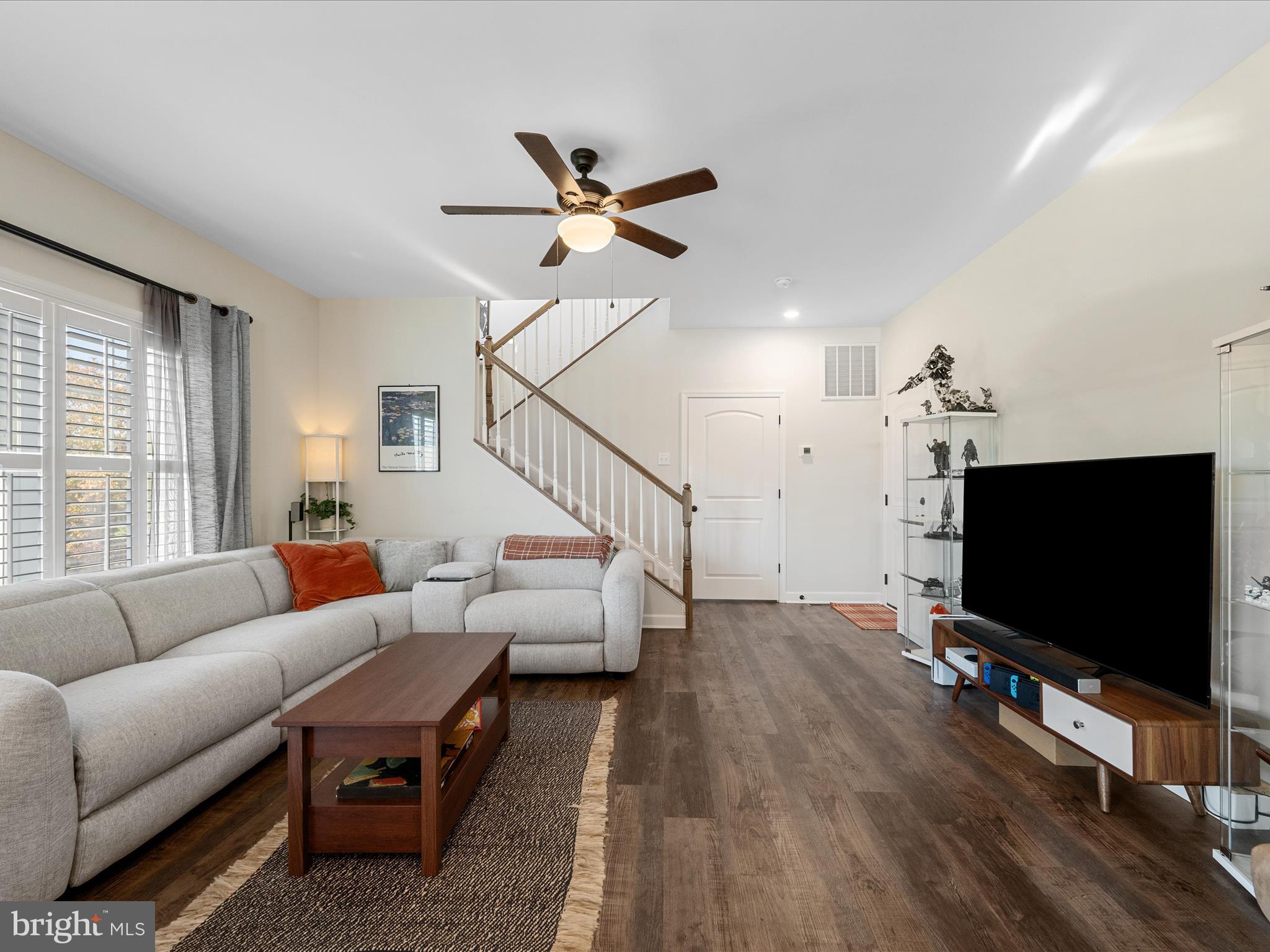 104 Larimar Lane Inwood, WV 25428 - Photo 18 of 57 a living room with furniture and a flat screen tv