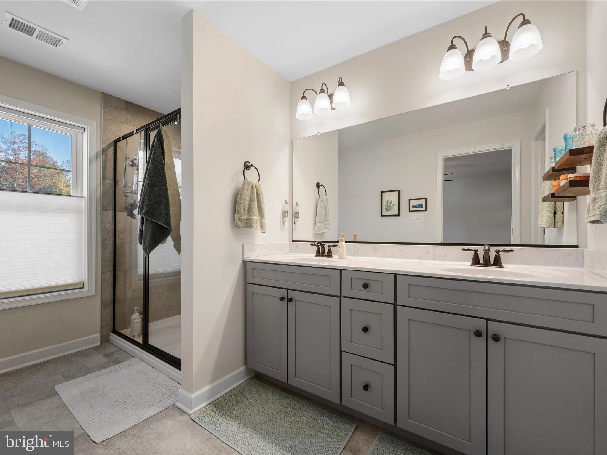 104 Larimar Lane Inwood, WV 25428 - Photo 25 of 57 a bathroom with a double vanity sink and mirror