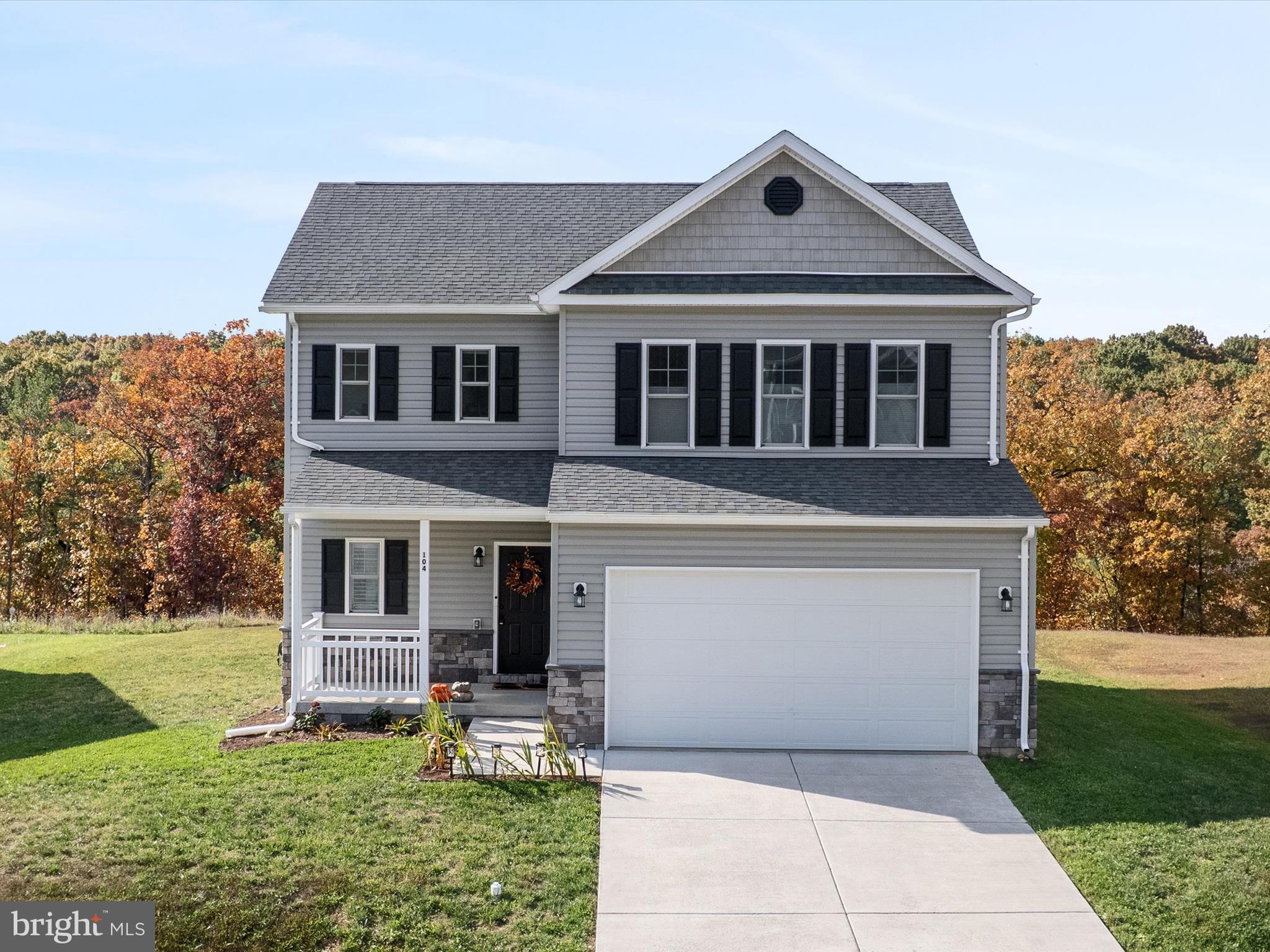 104 Larimar Lane Inwood, WV 25428 - Photo 3 of 57 a front view of a house with garden