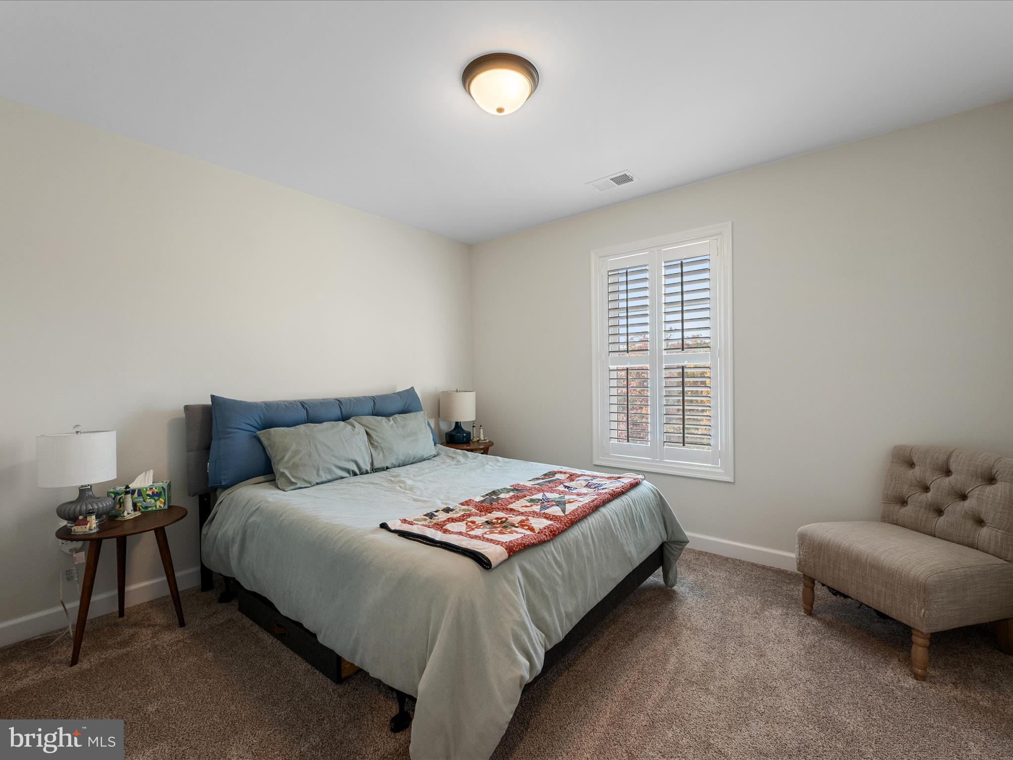 104 Larimar Lane Inwood, WV 25428 - Photo 31 of 57 a bedroom with a bed and a couch