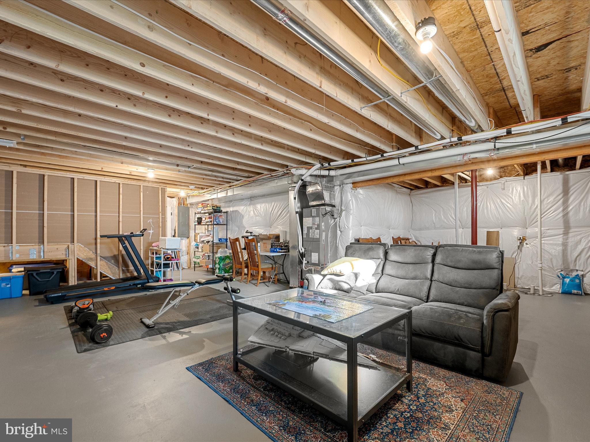 104 Larimar Lane Inwood, WV 25428 - Photo 36 of 57 a living room with furniture a air conditioner vent and a window
