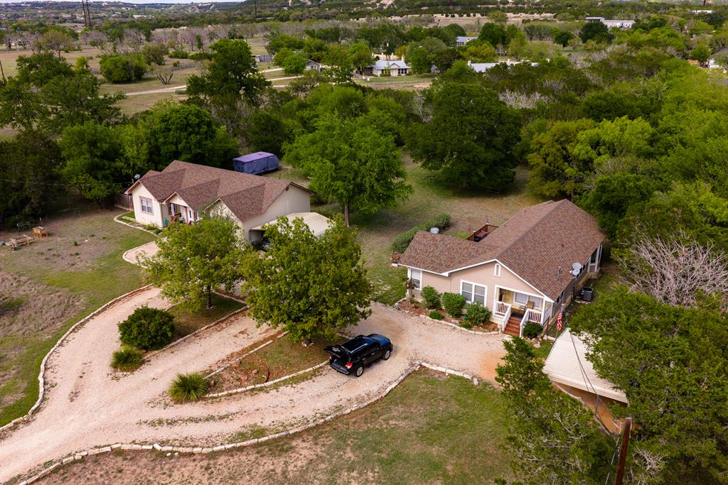 an aerial view of a house with yard swimming pool and outdoor seating