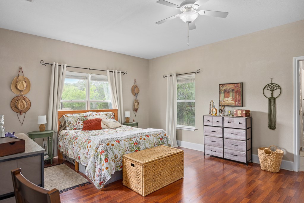 659 Town Creek Road Kerrville, TX 78028 - Photo 13 of 65 a bedroom with a bed and a window