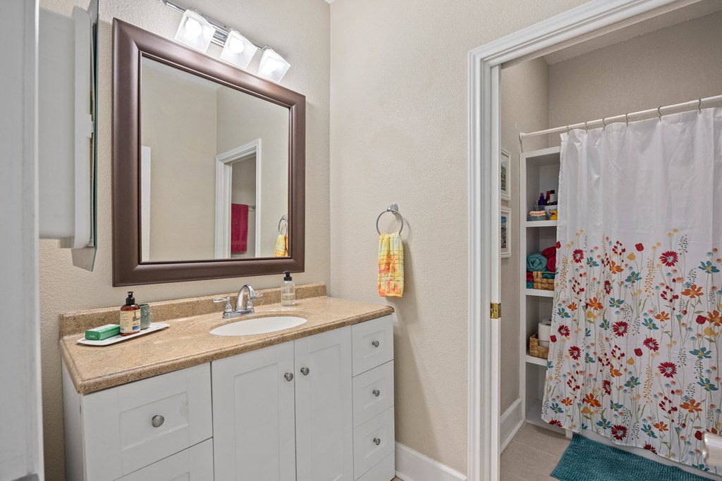 659 Town Creek Road Kerrville, TX 78028 - Photo 16 of 65 a bathroom with a sink and a mirror