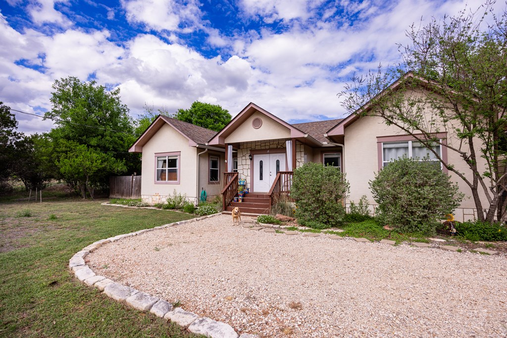 659 Town Creek Road Kerrville, TX 78028 - Photo 20 of 65 a front view of a house with a yard and garage