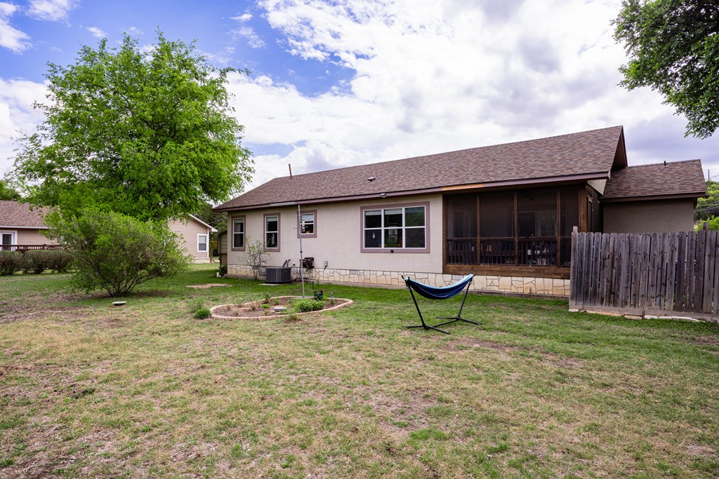 659 Town Creek Road Kerrville, TX 78028 - Photo 23 of 65 a view of a house with backyard