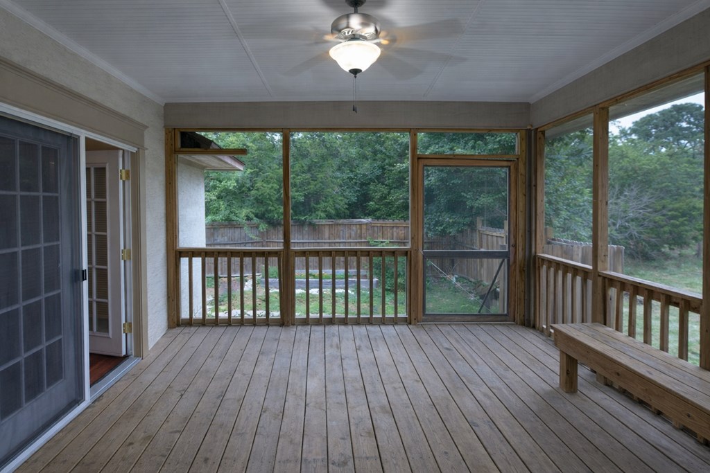 659 Town Creek Road Kerrville, TX 78028 - Photo 26 of 65 a view of a room with wooden floor fan and a balcony