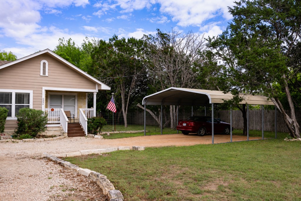 659 Town Creek Road Kerrville, TX 78028 - Photo 32 of 65 front view of a house with a yard