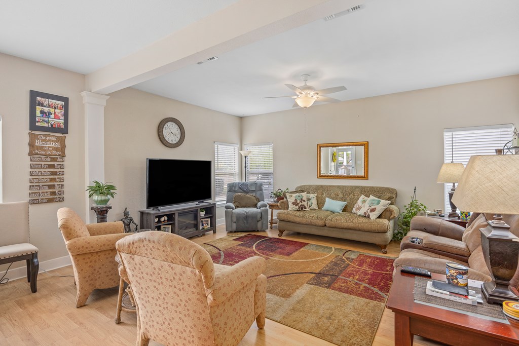 659 Town Creek Road Kerrville, TX 78028 - Photo 36 of 65 a living room with furniture and a flat screen tv