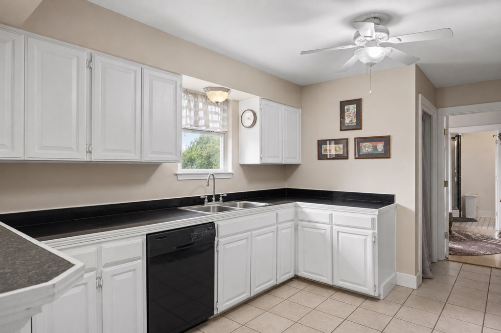 659 Town Creek Road Kerrville, TX 78028 - Photo 40 of 65 a kitchen with white cabinets and white appliances