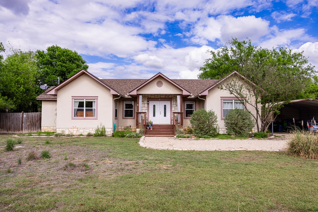 659 Town Creek Road Kerrville, TX 78028 - Photo 4 of 65 a front view of a house with a yard and garage
