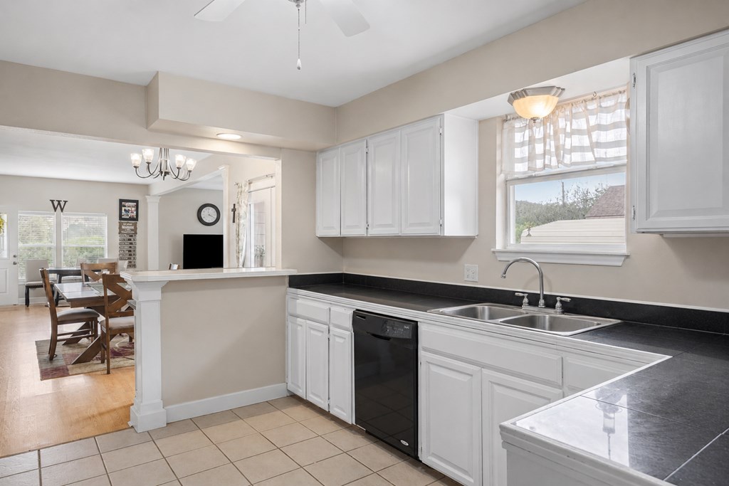 659 Town Creek Road Kerrville, TX 78028 - Photo 42 of 65 a kitchen with a sink cabinets and window