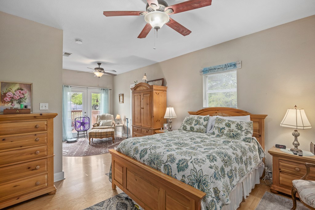 659 Town Creek Road Kerrville, TX 78028 - Photo 44 of 65 a bedroom with a bed and furniture