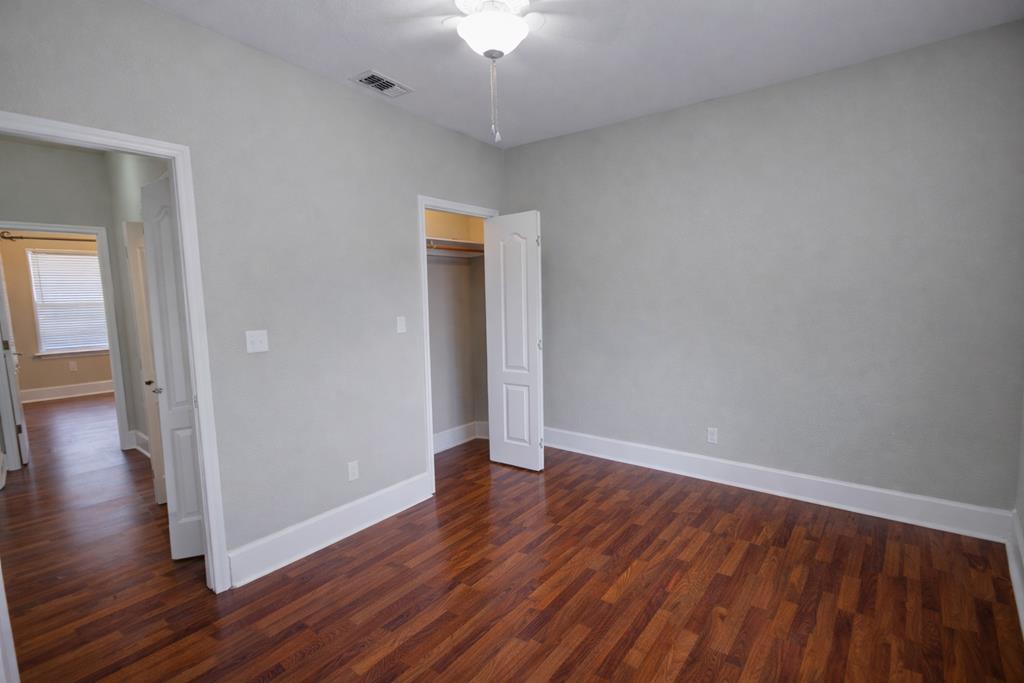 659 Town Creek Road Kerrville, TX 78028 - Photo 49 of 65 a view of an empty room with wooden floor