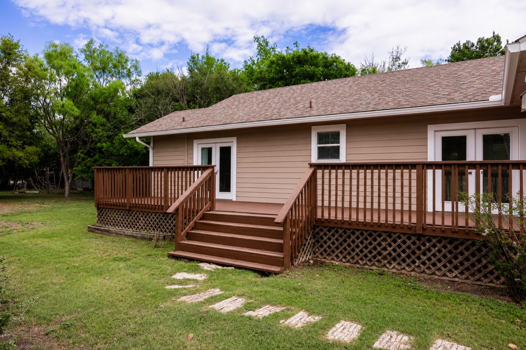659 Town Creek Road Kerrville, TX 78028 - Photo 52 of 65 a view of a house with a yard