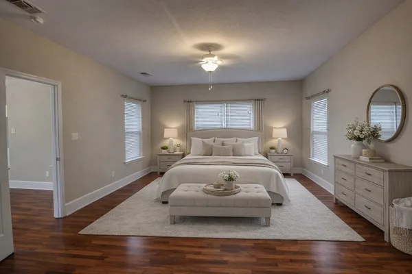 a bedroom with a bed and window