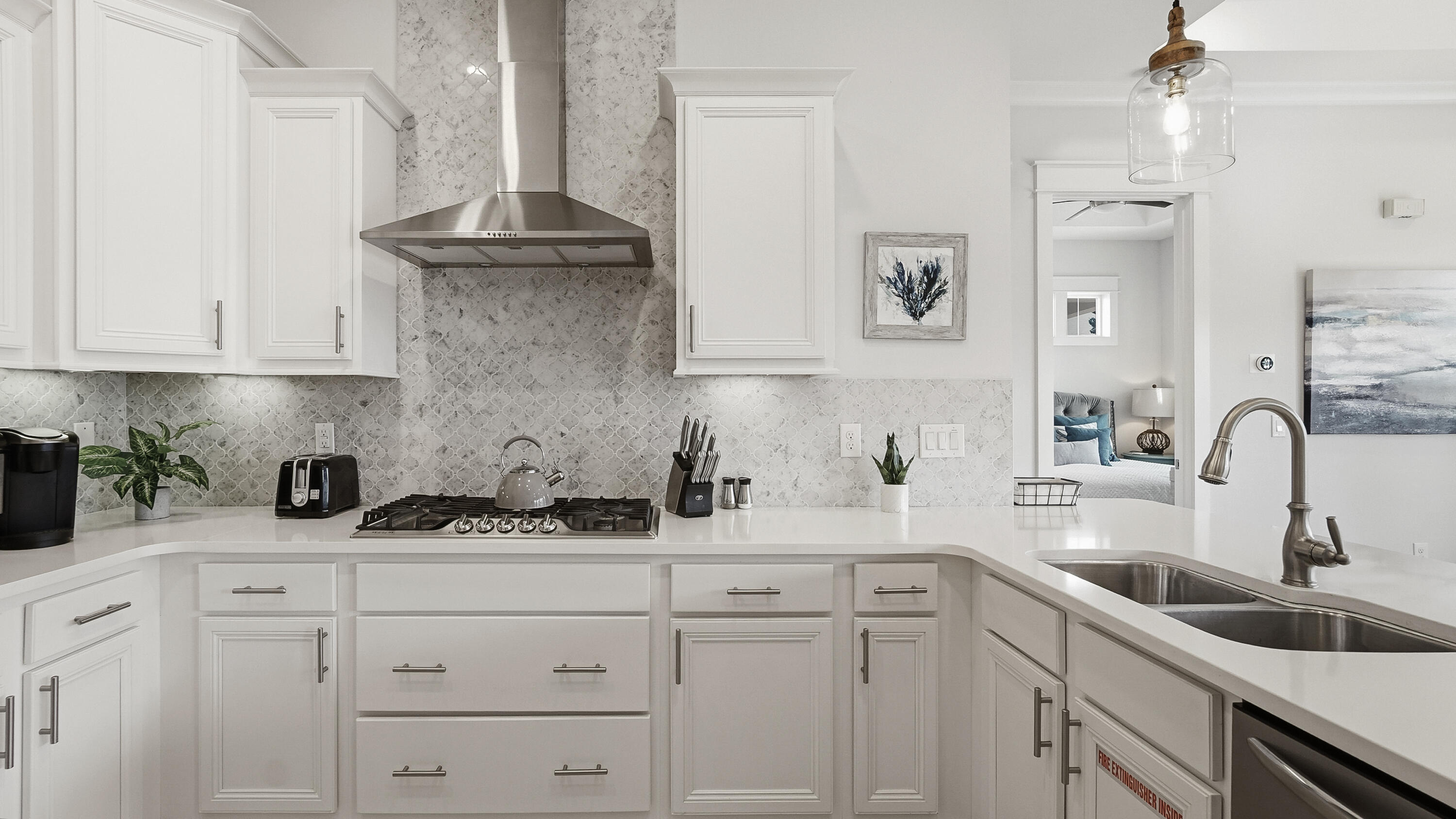 197 Milestone Drive, Unit C Inlet Beach, FL 32461 - Photo 12 of 72 a kitchen with cabinets stainless steel appliances and a sink