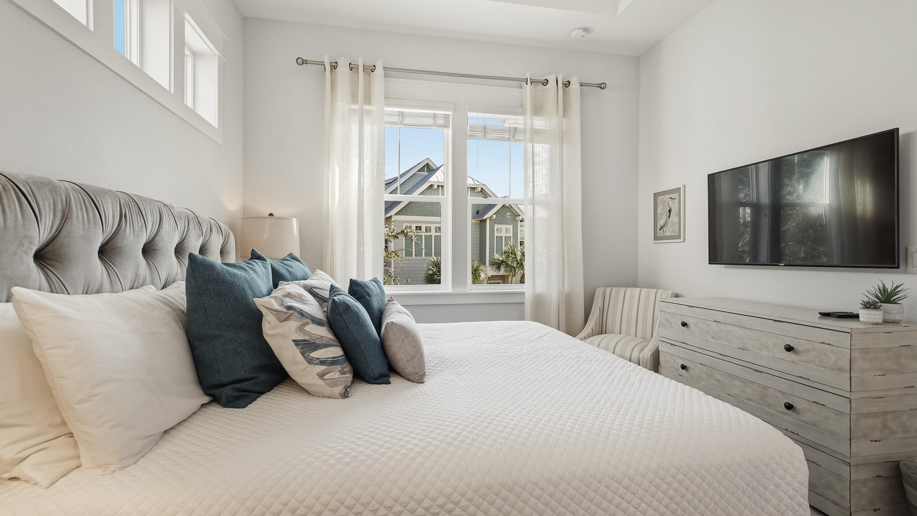 197 Milestone Drive, Unit C Inlet Beach, FL 32461 - Photo 22 of 72 a bedroom with a bed and a flat screen tv