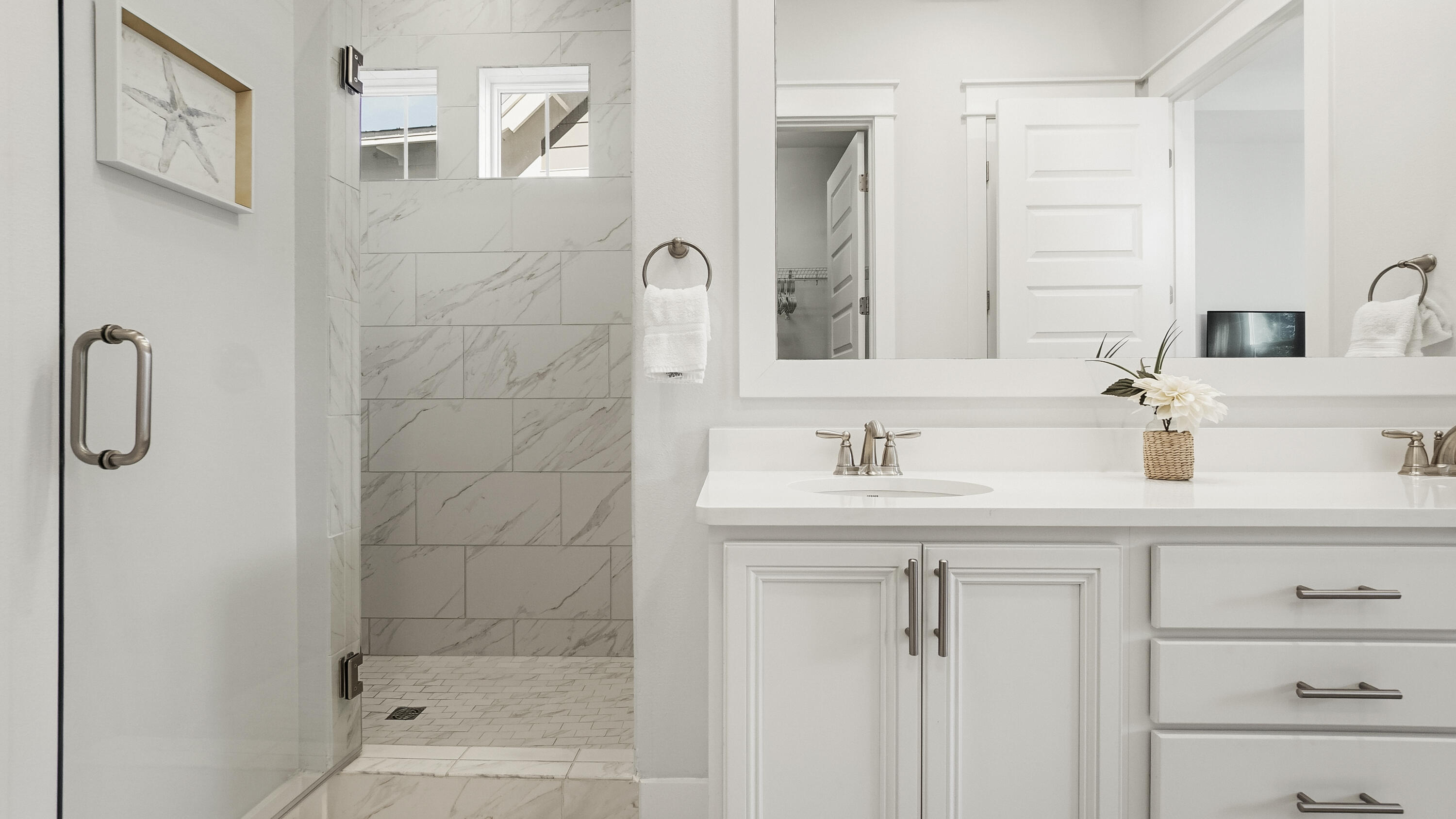 197 Milestone Drive, Unit C Inlet Beach, FL 32461 - Photo 29 of 72 a bathroom with a granite countertop sink a mirror and a shower