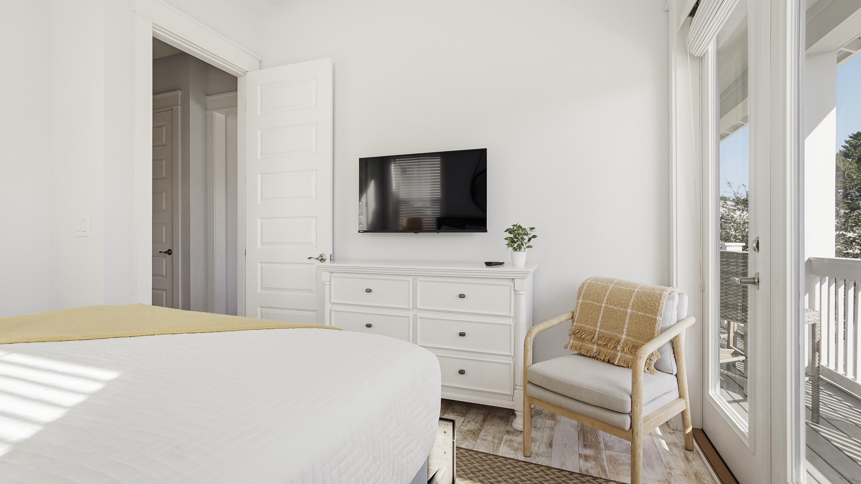 197 Milestone Drive, Unit C Inlet Beach, FL 32461 - Photo 35 of 72 a bedroom with a bed and flat screen tv