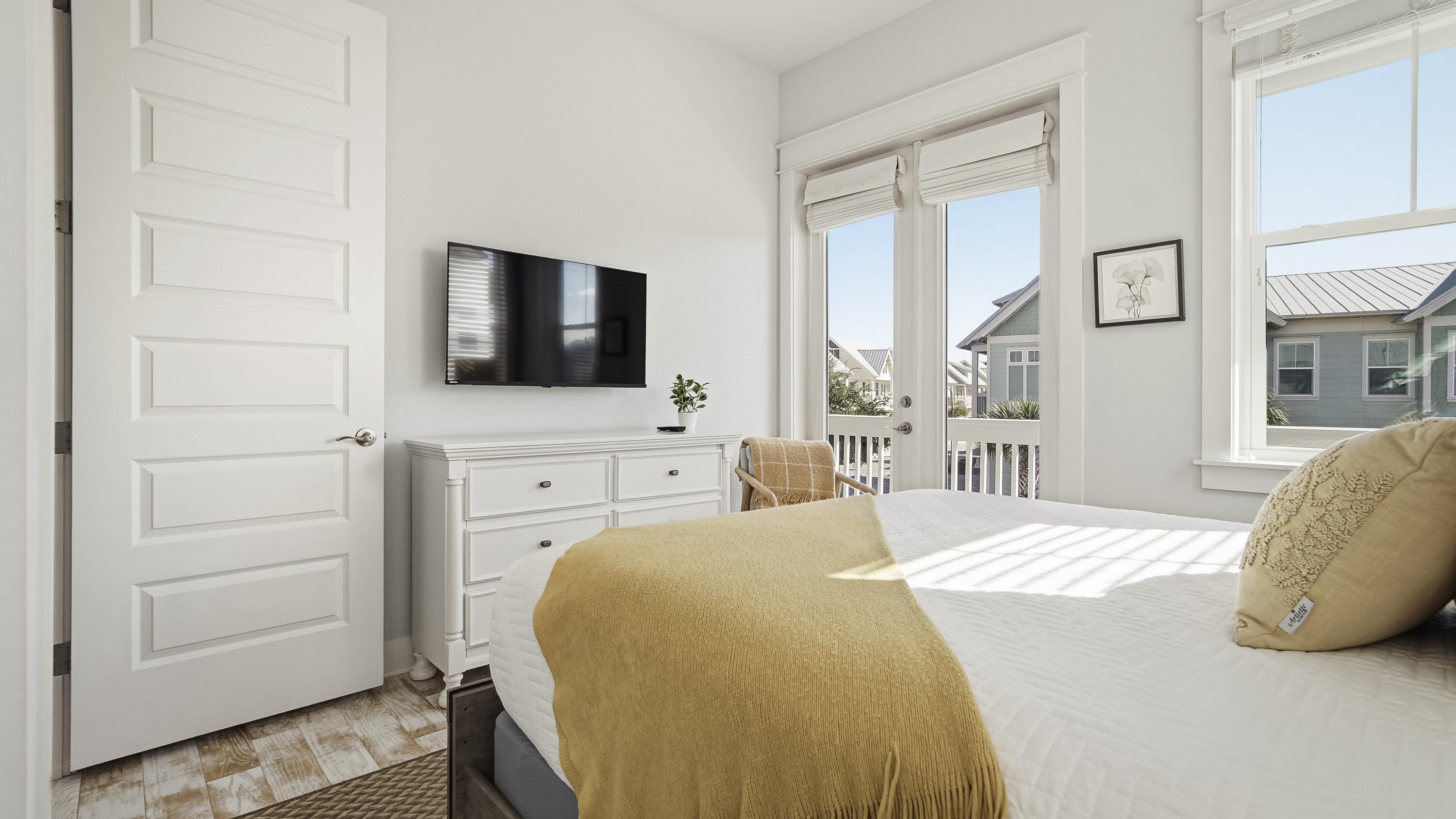 197 Milestone Drive, Unit C Inlet Beach, FL 32461 - Photo 36 of 72 a bedroom with a bed and flat screen tv