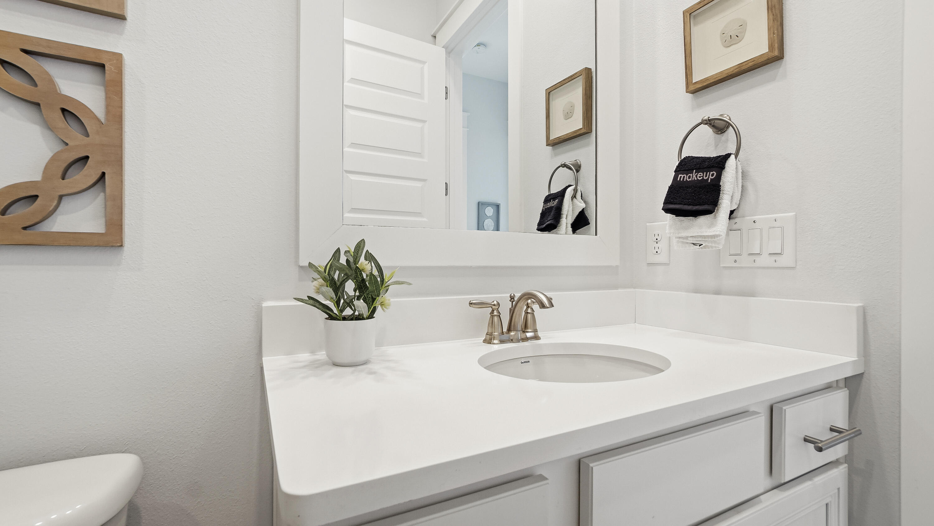 197 Milestone Drive, Unit C Inlet Beach, FL 32461 - Photo 40 of 72 a bathroom with a sink and a mirror
