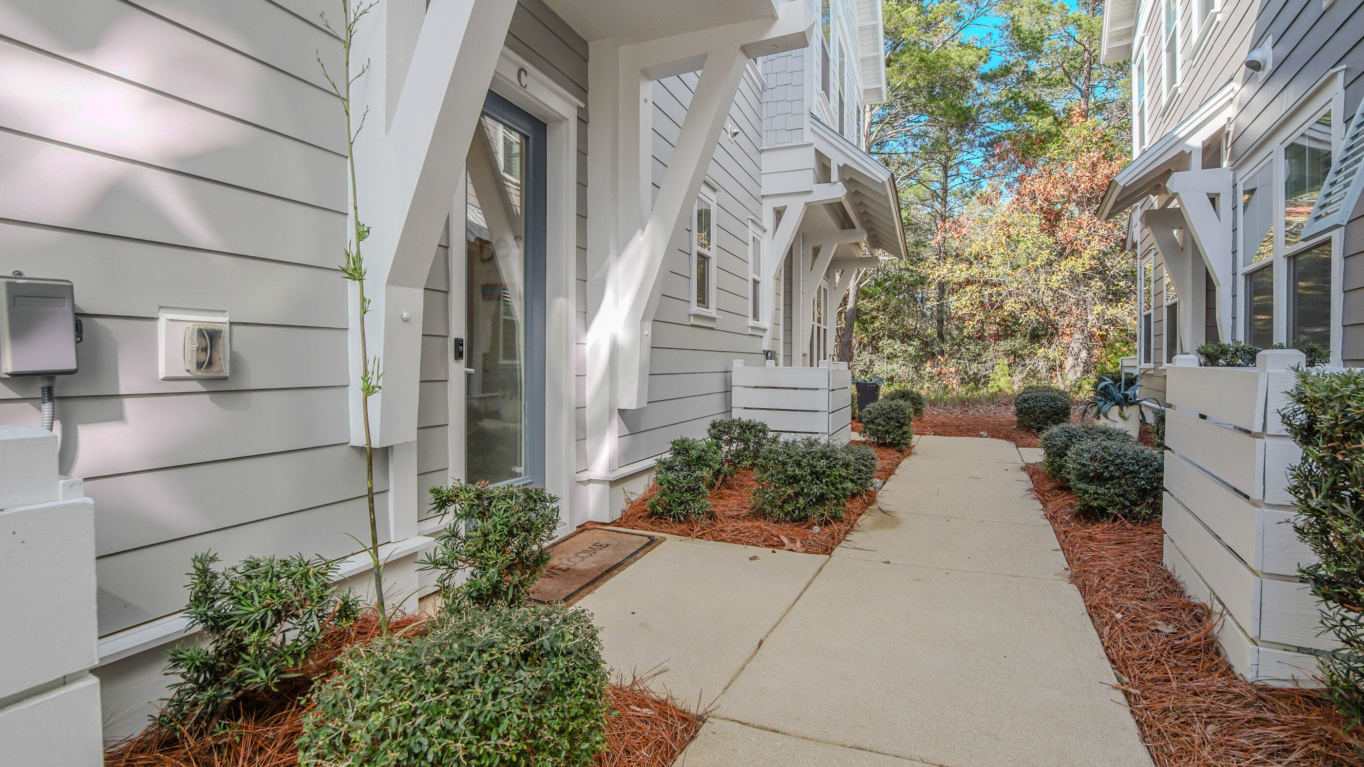 197 Milestone Drive, Unit C Inlet Beach, FL 32461 - Photo 54 of 72 a view of a pathway both side of building
