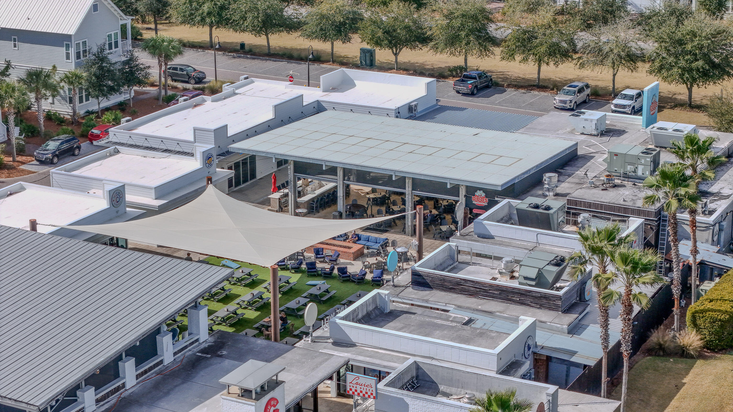 197 Milestone Drive, Unit C Inlet Beach, FL 32461 - Photo 62 of 72 an aerial view of a house with garden space and street view