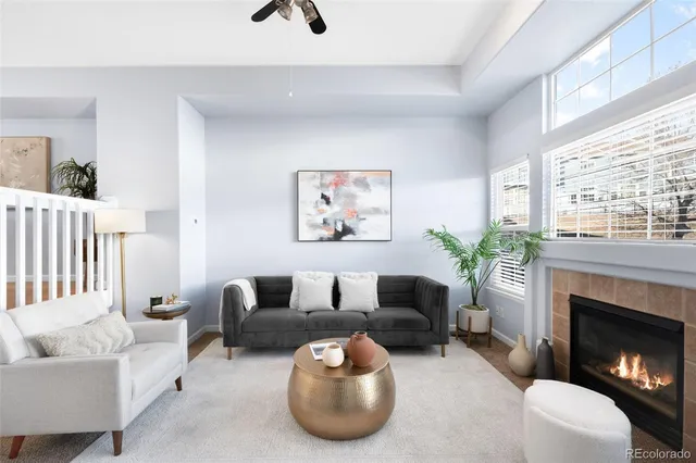 a living room with furniture a window and a fireplace