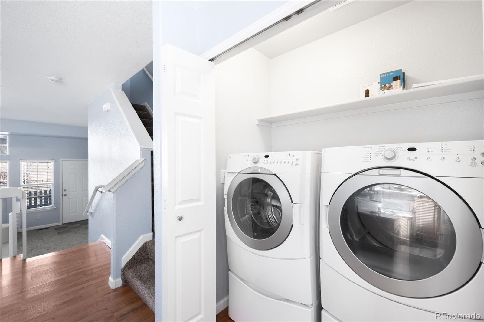 8199 Welby Road, Unit 3102 Denver, CO 80229 - Photo 18 of 18 a utility room with dryer and washer