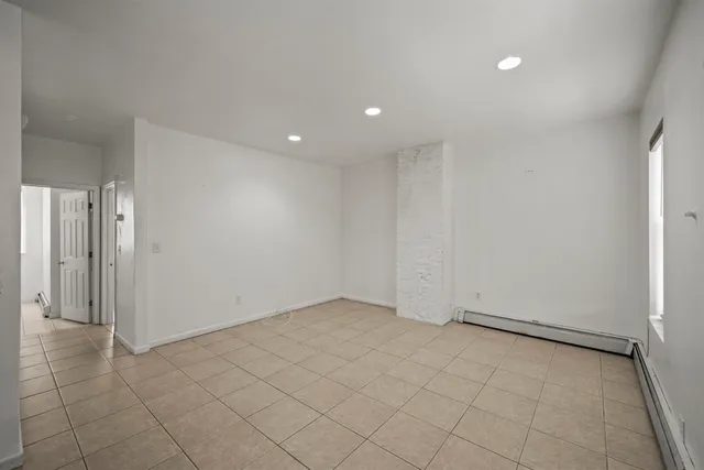 an empty room with a fireplace