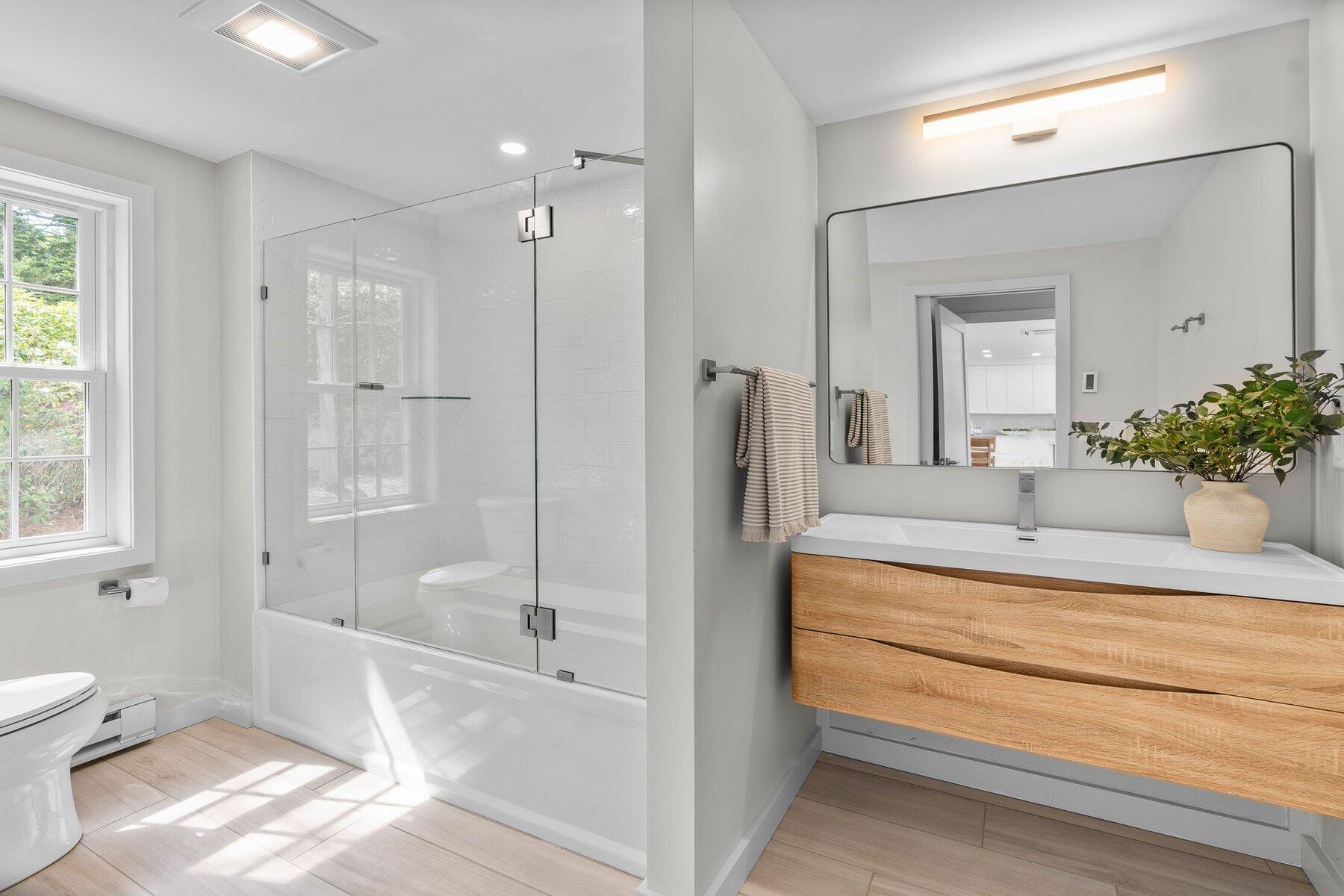 162 Main Street Osterville, MA 02655 - Photo 26 of 50 a spacious bathroom with a tub and shower
