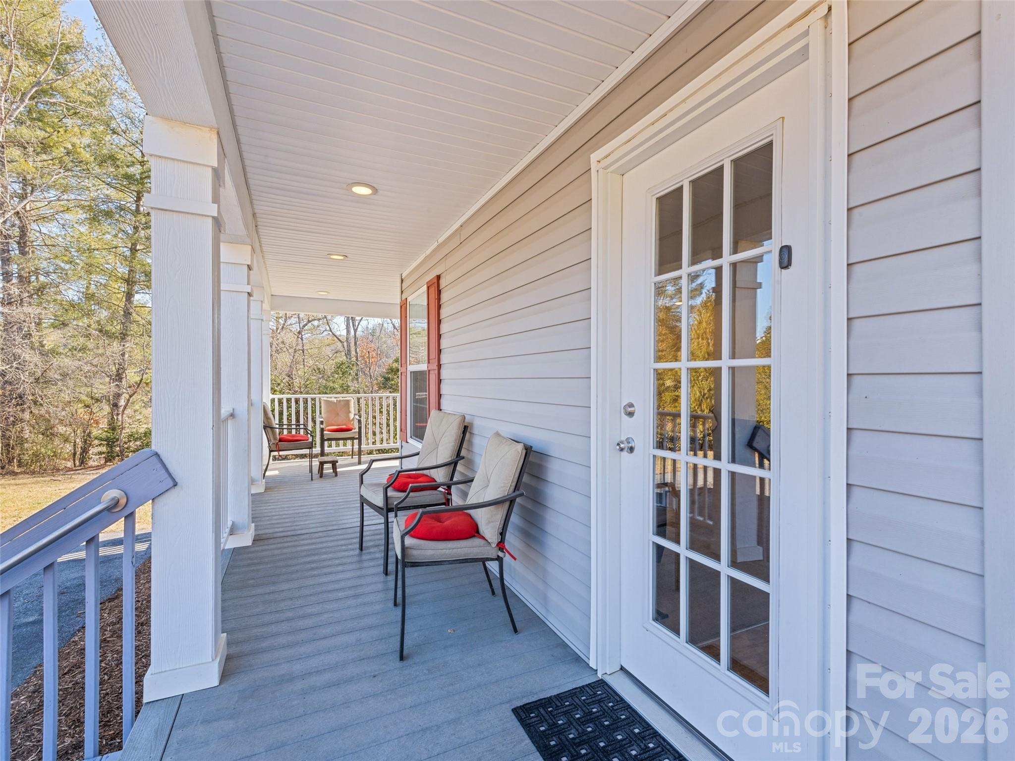 a balcony with furniture and rug